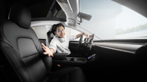 a man sitting in a car with headphones on