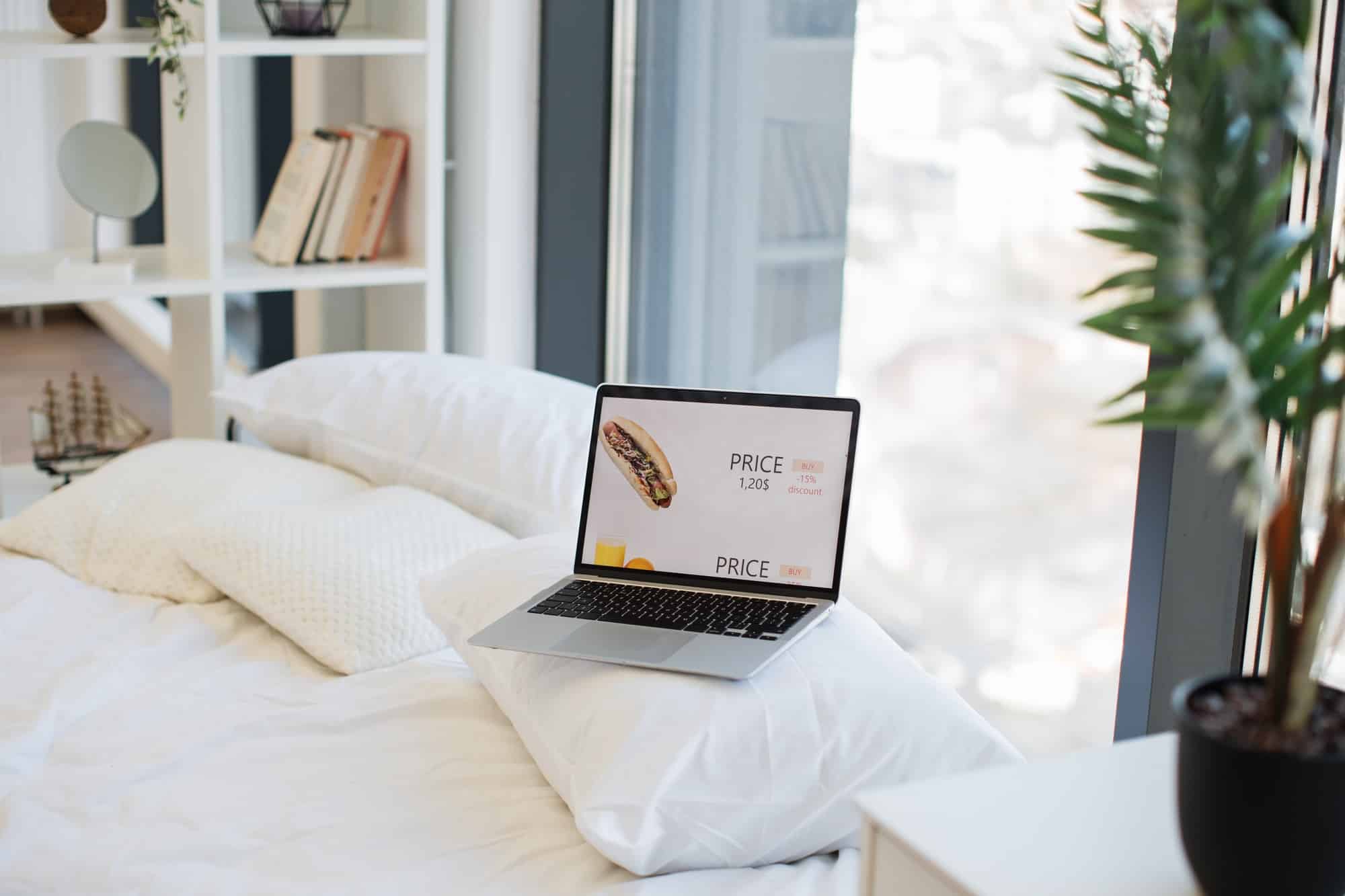 Laptop with discount prices of food on screen
